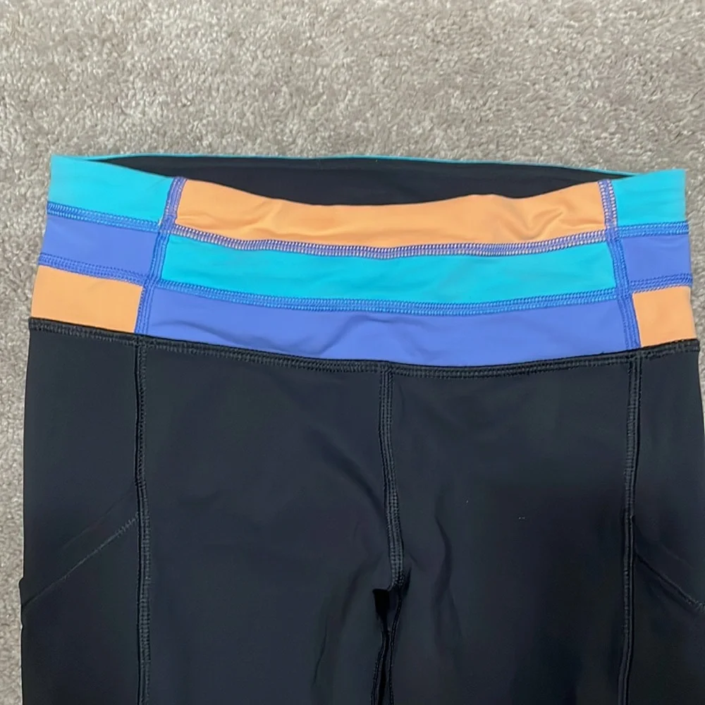 Size 2 Lululemon black pants with side pockets. - Picture 2 of 5